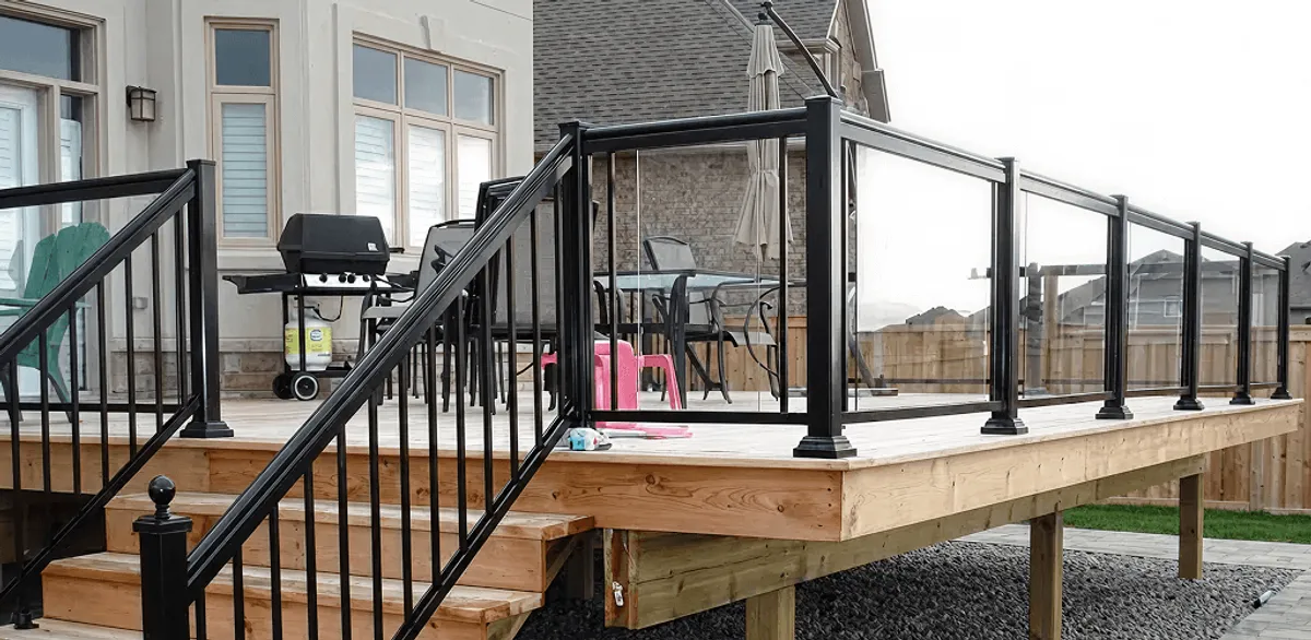 Handrail installation on a deck staircase for safety and code compliance in Pueblo, CO