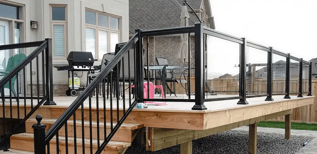 Handrail installation on a deck staircase for safety and code compliance in Pueblo, CO